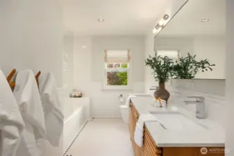 Between the second and third bedroom is this beautiful bathroom.