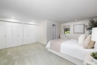 Large primary suite with windows out to view and also back out to the beautiful garden.