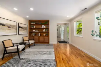 Library/den area between the entry and kitchen. Built in shelving and storage.