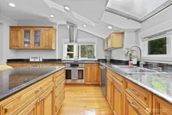 Kitchen - slab granite over quality wood cabinets