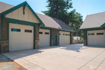 The 4 car wide shop has 10' tall doors and a half bath.
