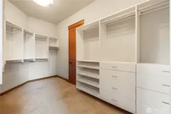 Primary closet with custom organization.