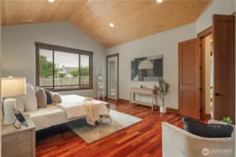 Primary suite offers private door to covered outdoor space.