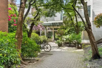 The courtyard features a bike rack.