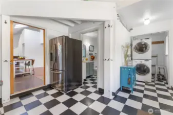 Enter to a HUGE mudroom with laundry and bath