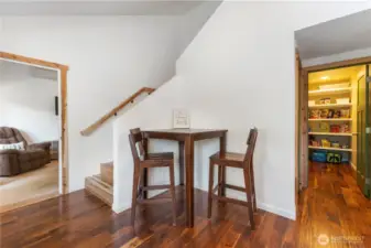 eat in kitchen w huge panty and addition storage closet under stairs. Stairs, hand rail and trim are custom cedar