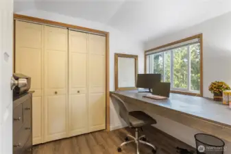 2nd bedroom being used as an office. The desk is a platform for a extra long twin mattress