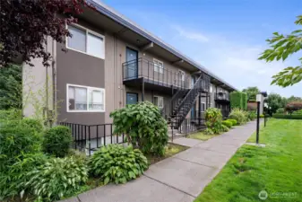 Well-kept building with landscaping and welcoming entry.