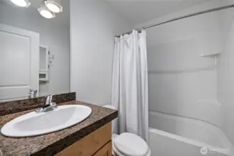 Clean, functional bathroom ready for your personal touch.