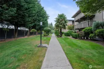 Lush green common areas throughout the property.