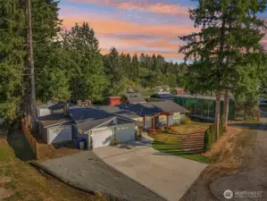 Tons of parking, 3-car attached garage(s) and RV parking in front. 3rd bay is a pull-through garage (not shown in photo).