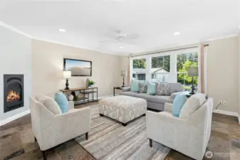 Elegant crown molding adds timeless style and large windows bring in natural light.