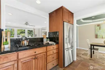 Chefs delight at gas cook-top. Open view to living and dining rooms create connected space ideal for cooking and entertaining in this Kirkland home.