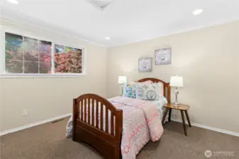 Roomy upstairs corner bedroom at the end of the hallway.
