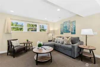 Spacious lower-level recreation room is perfect for games, home theater, and other gatherings in this Kirkland home.