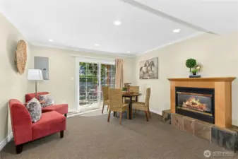 With gas fireplace and sliding door to backyard patio, this versatile space great for relaxing or entertaining.