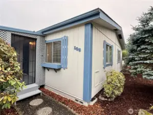 Nice landscaping and pathway leading to the covered front porch.