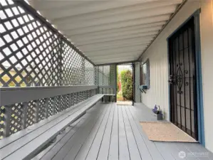 Covered front porch with security screen doors on both the front and back.