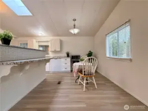 More of the dining area with an eating bar.