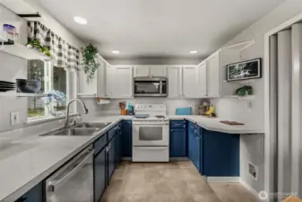 Bright and open kitchen with lots of cabinets and counter space
