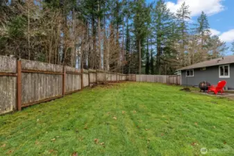This fully fenced yard backs up to a greenbelt and has so much room!