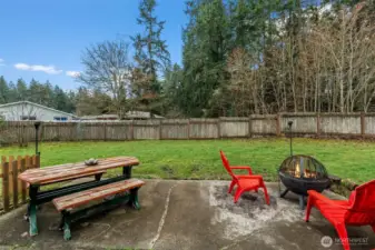 Patio off kitchen looks out at trees and nature