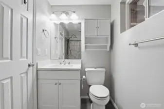 Primary bath updated with quartz and new tile bath-tub surround & upgraded shower plumbing fixtures