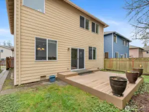 Step into your own secluded retreat—this fully fenced backyard offers a private, peaceful escape. Enjoy quiet evenings on the newer Trex deck overlooking a beautifully maintained, low-maintenance lawn, perfect for relaxing or entertaining.