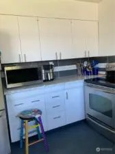 Kitchen includes stainless appliances.