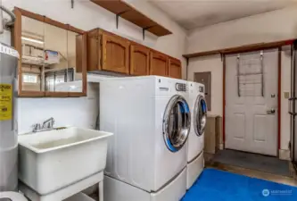 Laundry in garage which is drywalled out