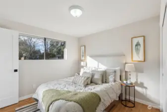 Primary bedroom with    Half Bath through the open door