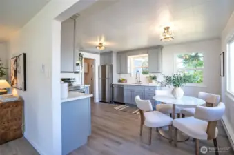 Living room flows into entertainment sized kitchen and is accented by windows usher in tons of natural light.