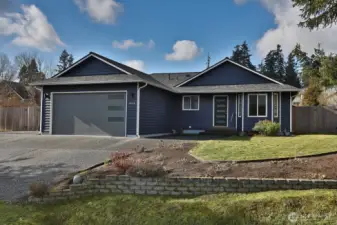 Donning a new color with updated garage and front doors, this home is move-in ready. Low maintenance lot has a sweet balance of front yard charm and backyard privacy. Keep it simple or expand your gardens.