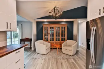 Sellers have used this as a sitting area connected to the kitchen. Great spot to enjoy a cocktail before dinner. Could also serve as a dining area. **Please note the light fixture above does not convey.**