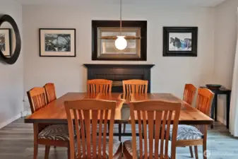 Sellers have used this room as their dining room. Previous owner used this as their den/TV room. The space above the propane fireplace is where the previous owner had their TV mounted. Sliding doors to your backyard are to the right of the table, just beyond the right edge of this photo. Garage door is just beyond the left edge of this photo.