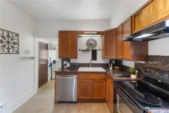 Entry to the backyard and deck is through the kitchen.