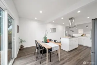 The dining room opens out to the new Trex deck and is open to the kitchen.