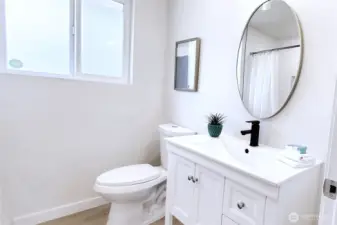 Main Bath completely renovated with brand new vanity, sink faucet & toilet