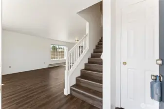 Entry to large greatroom with luxury vinyl plank for easy maintenance.