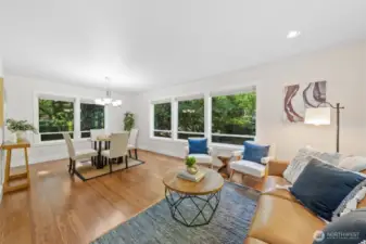 Just off the kitchen, this versatile space offers endless potential—use it as a casual dining nook, a sunny reading area, or a relaxed spot for morning coffee with views of nature around you.