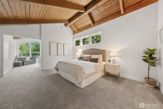 Enjoy peaceful mornings and private evenings in your Primary Suite that opens to a lofted seating area—framed by tree-filled views and natural light.