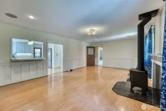 The large living and dining area. The toasty wood stove provides comfort and reduces utility bills.
