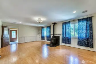 Big windows let in plenty of natural light, the door on the left the goes to the second bedroom.