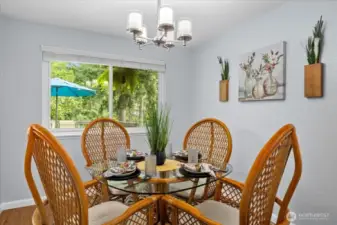 Dining area off the kitchen and living room for added convenience.