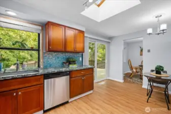 Sliding glass door off kitchen opens to a large back deck—perfect for entertaining.