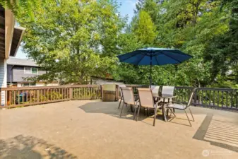 Enjoy peace and privacy on the the expansive deck overlooking the lush greenbelt