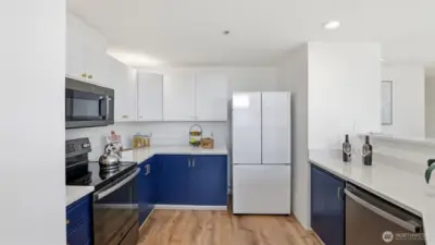 Contemporary two-tone cabinetry adds a bold touch to this bright, efficient space.