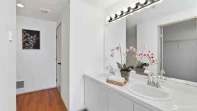 Spacious ensuite bath with dual sinks and ample counter space.