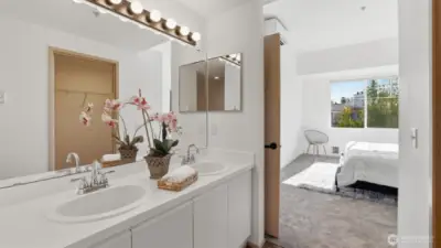 Relax and unwind in the large soaking tub featured in the primary bath.