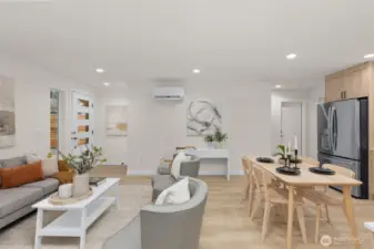 The ground level features a connected living floorplan- kitchen, living, & dining together